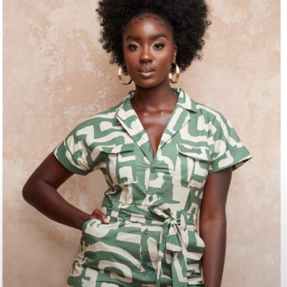 Asale in Olive Geometric is your new favorite romper! NWOT